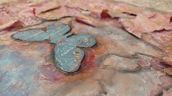 a close up view of a butterfly created using molding paste